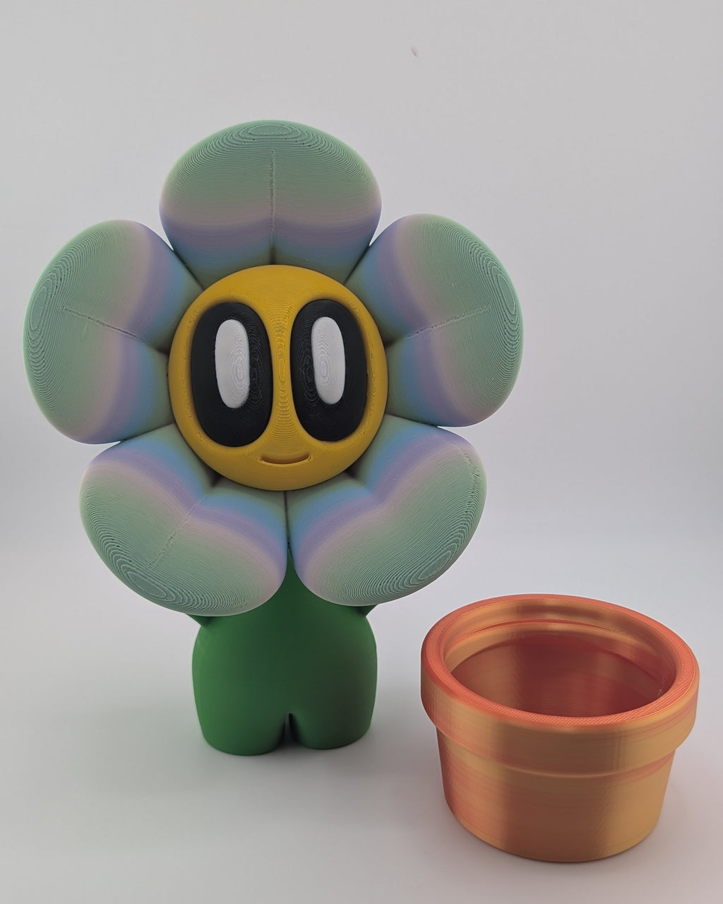 Flower-shaped toy with a pot on a white background