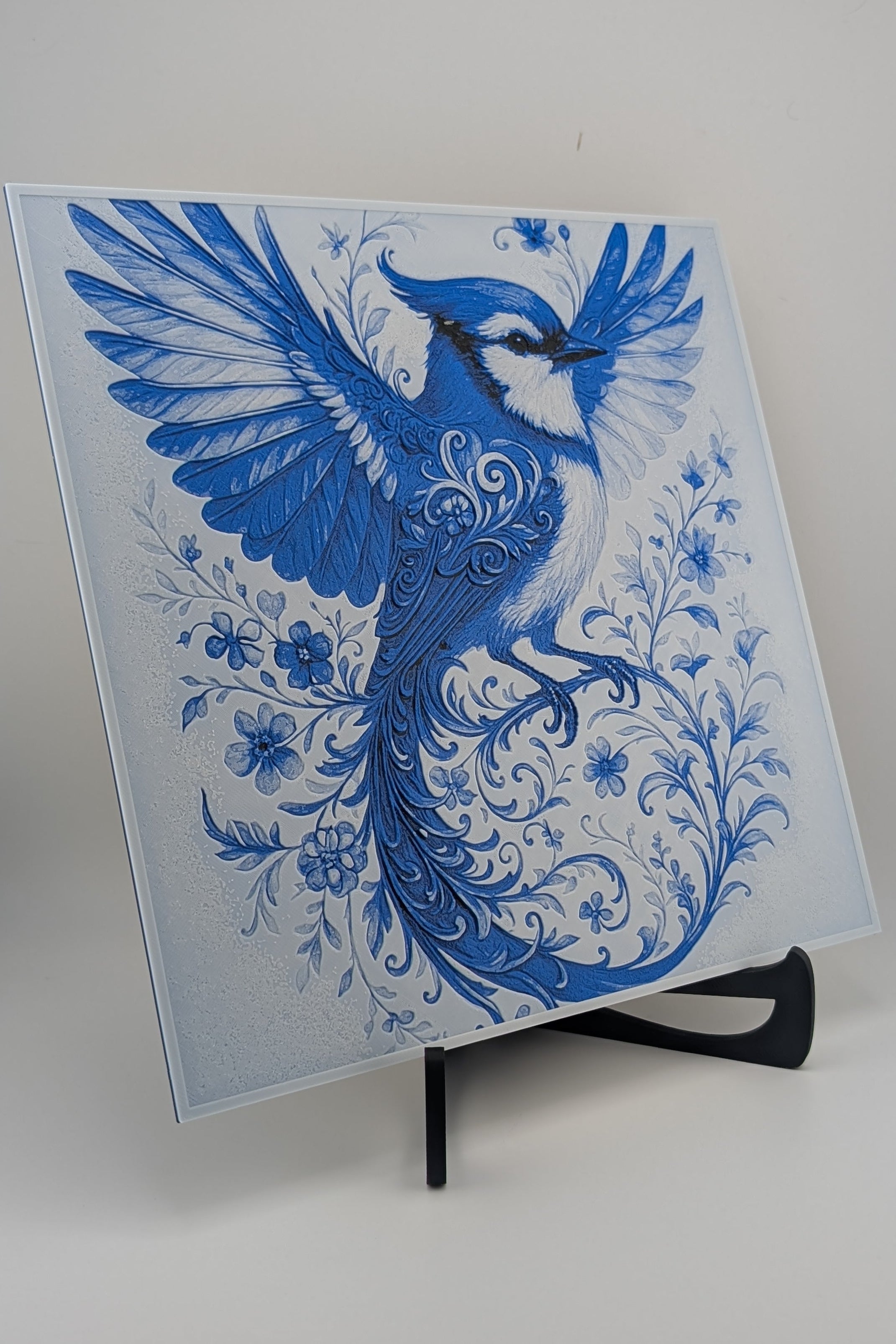 Blue bird design on a white background with a stand