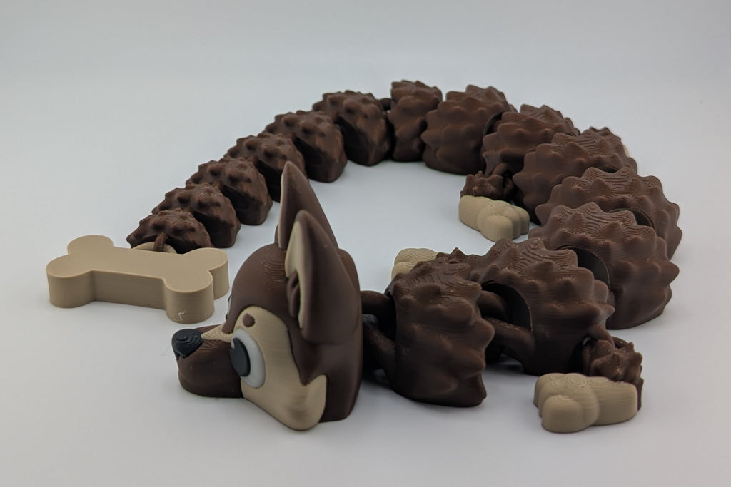 Dog toy shaped like a snake with bone pieces on a white background