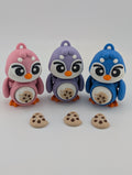 Waddle into fun with our Penguin Clicker Keychains!
