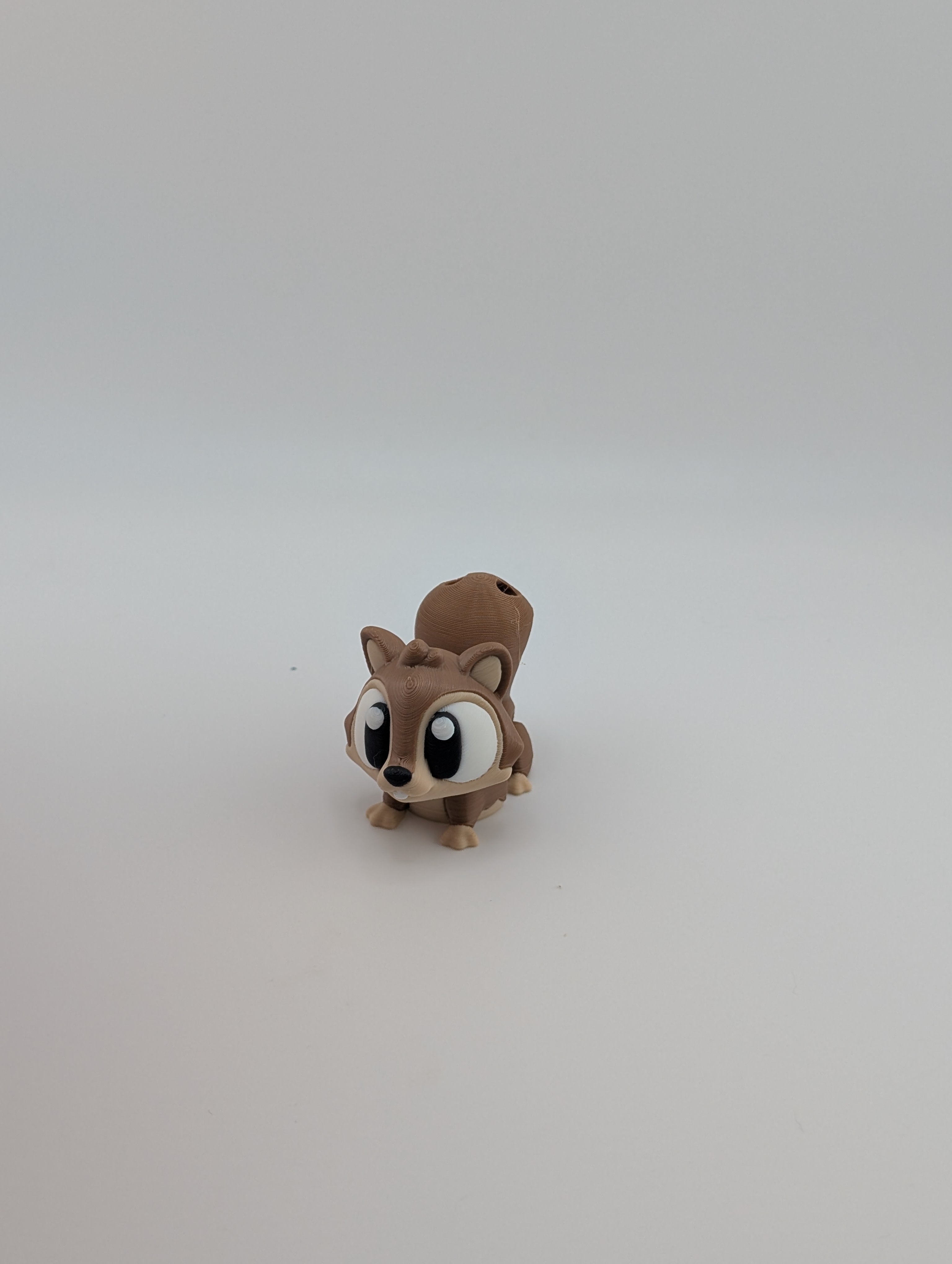 Add a dash of woodland whimsy with our Flexi Squirrel Keychain Charm!