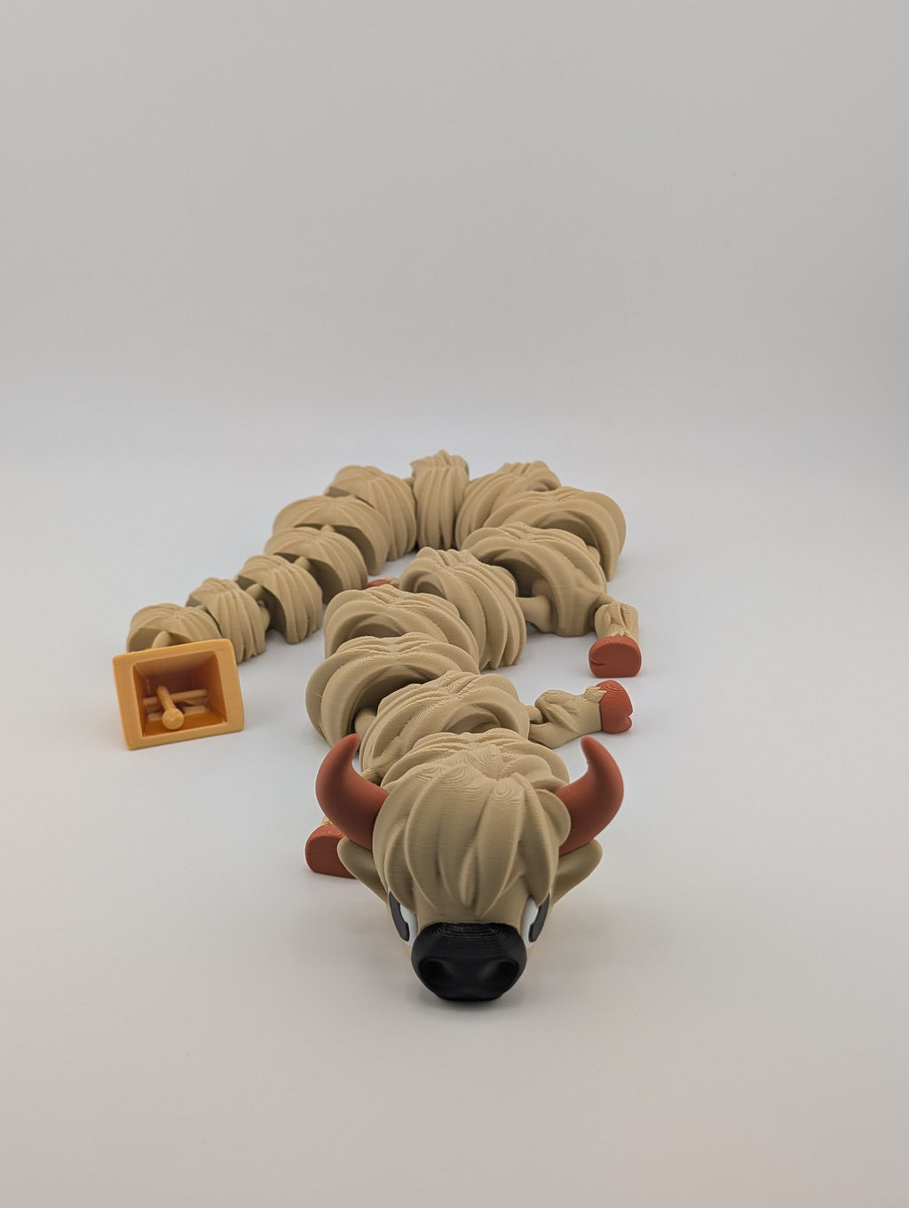 Highland Cow Flexi Dragon – 16.25" Fidget Charm