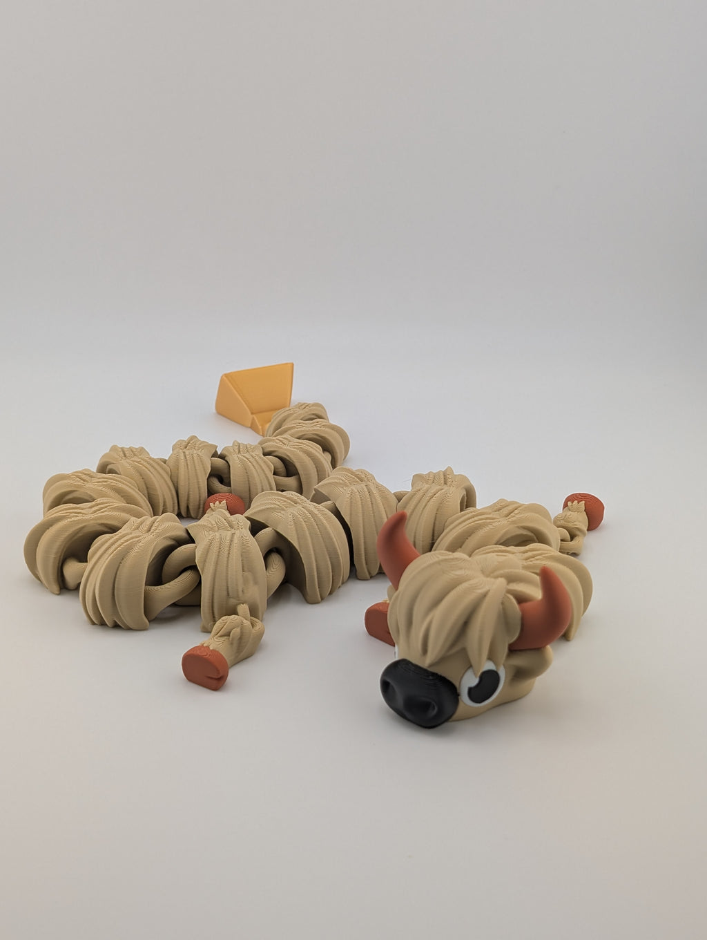 Highland Cow Flexi Dragon – 16.25" Fidget Charm