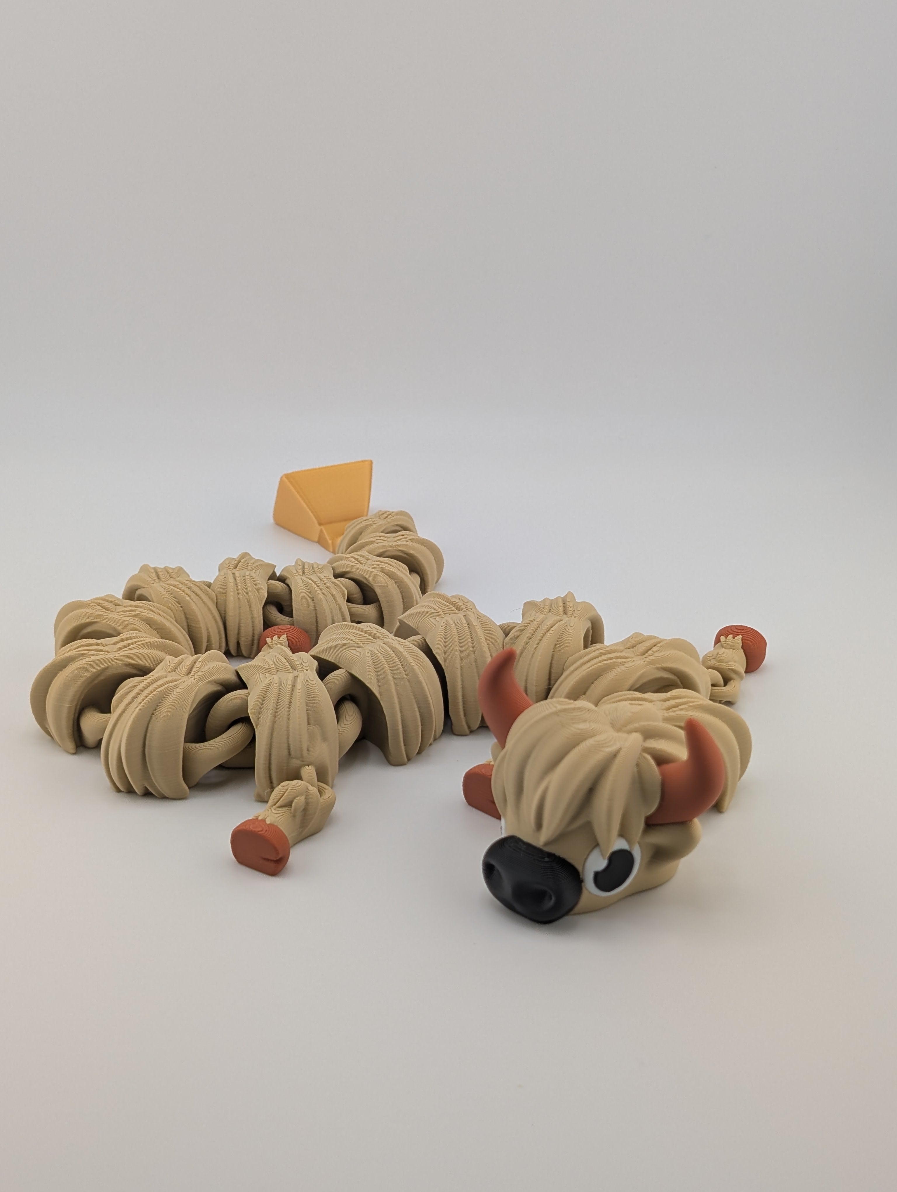 Highland Cow Flexi Dragon – 16.25" Fidget Charm