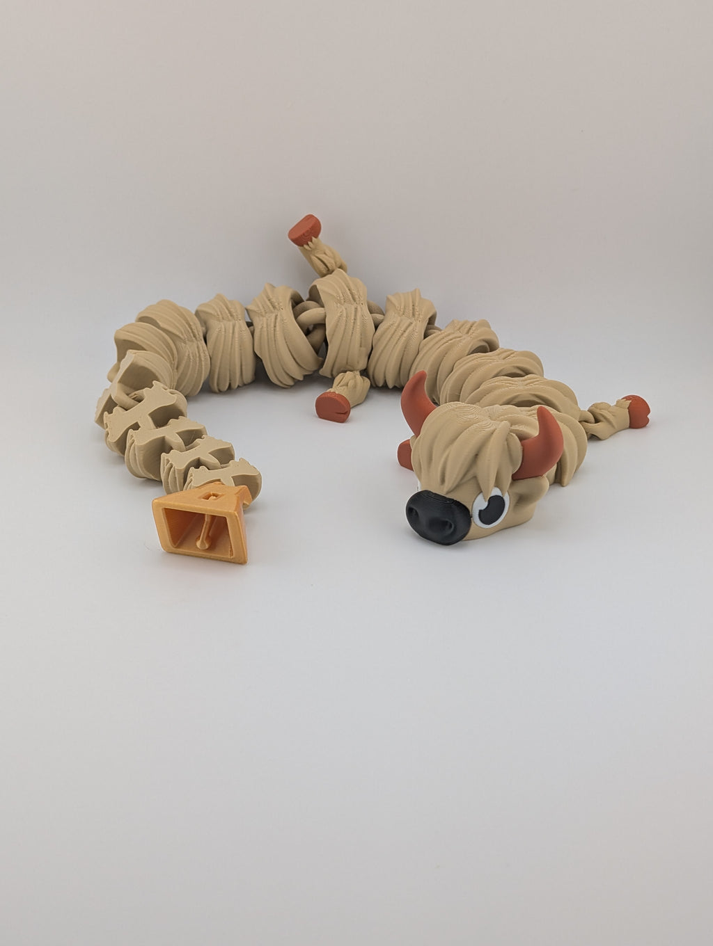 Highland Cow Flexi Dragon – 16.25" Fidget Charm