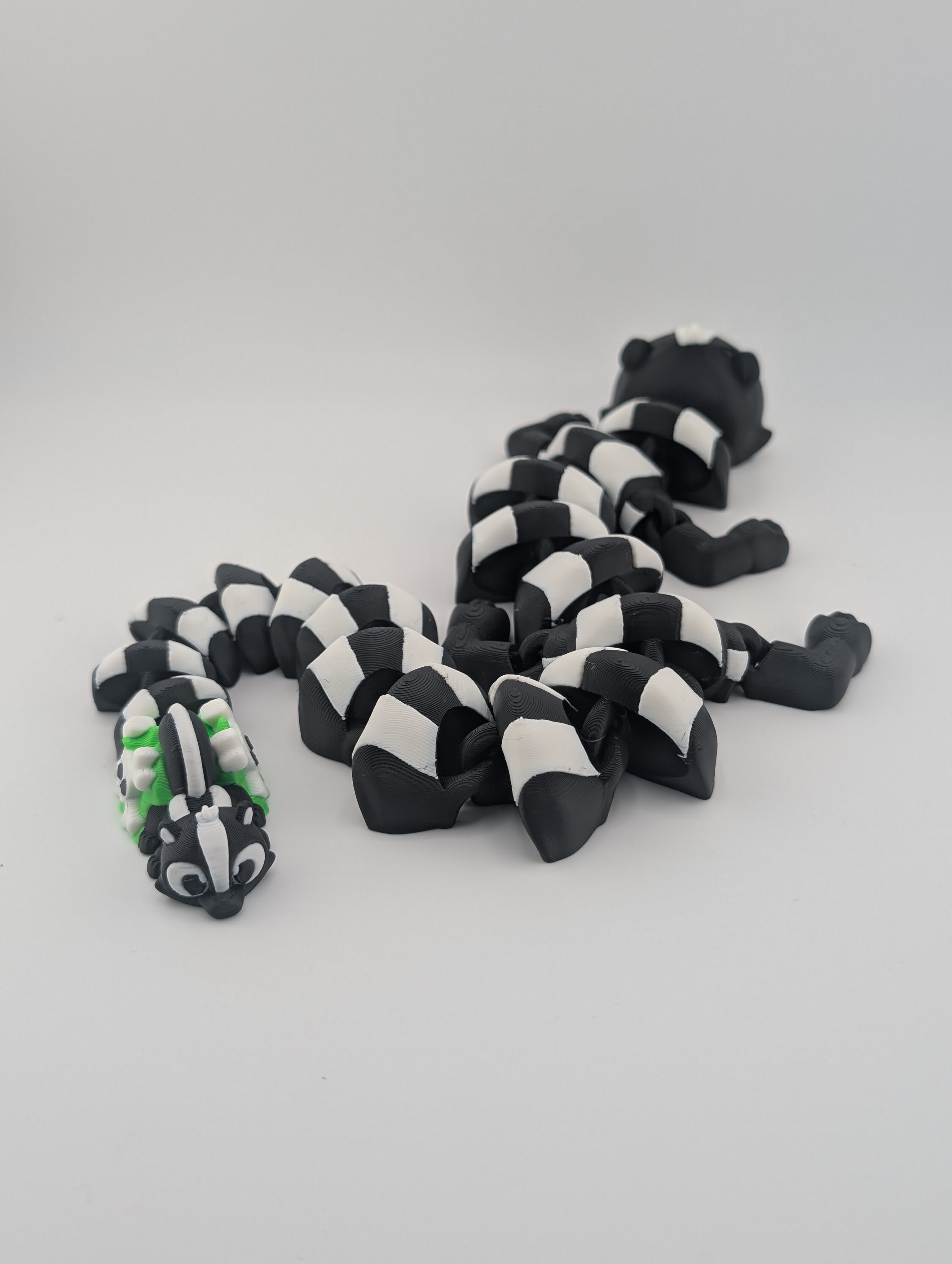 Skunk Flexi Dragon – 17.5" Articulated Fidget Friend