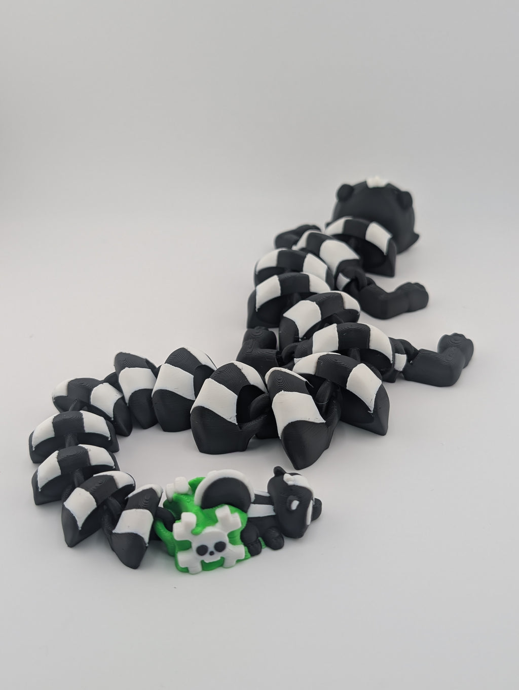Skunk Flexi Dragon – 17.5" Articulated Fidget Friend