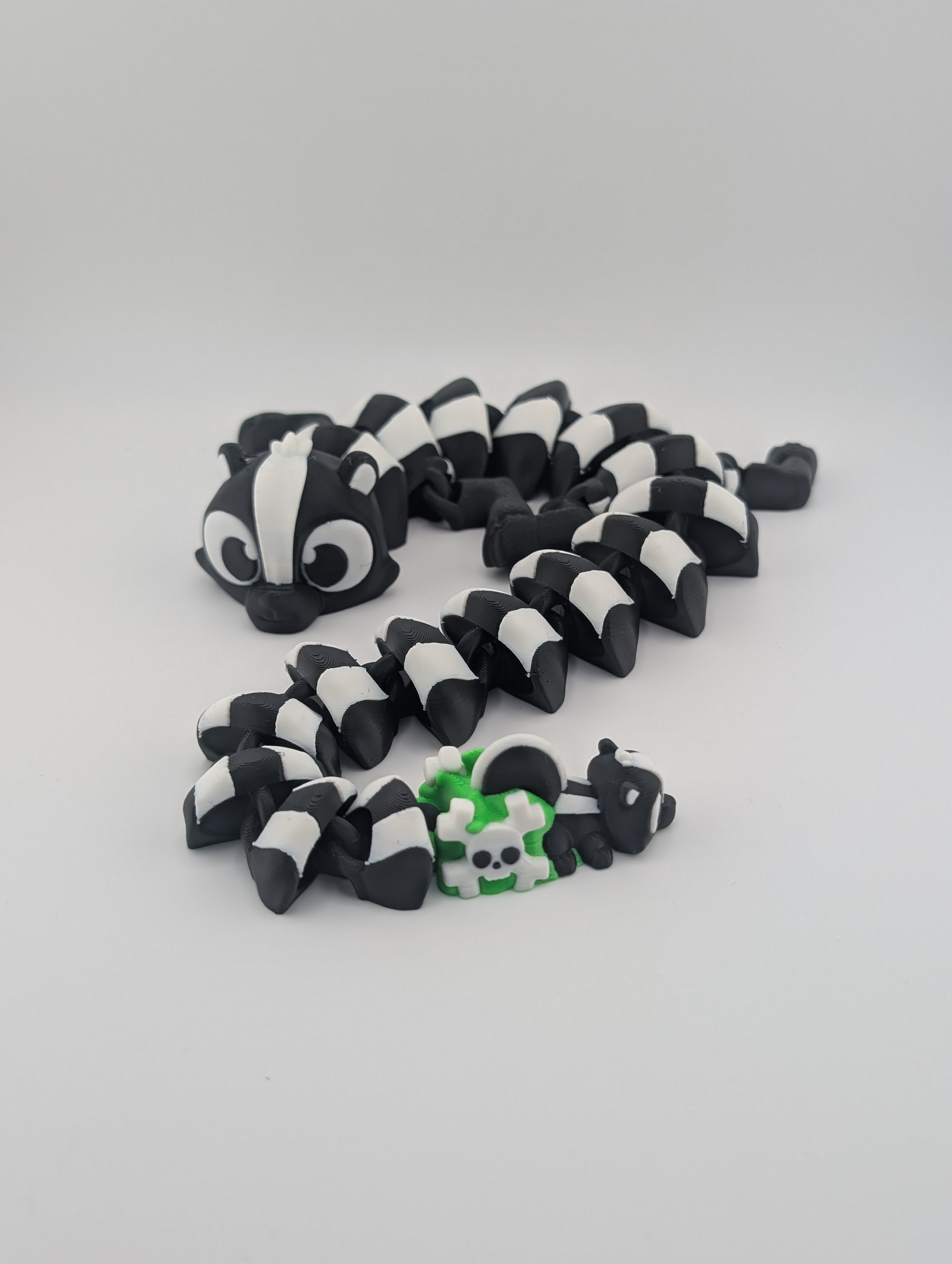 Skunk Flexi Dragon – 17.5" Articulated Fidget Friend