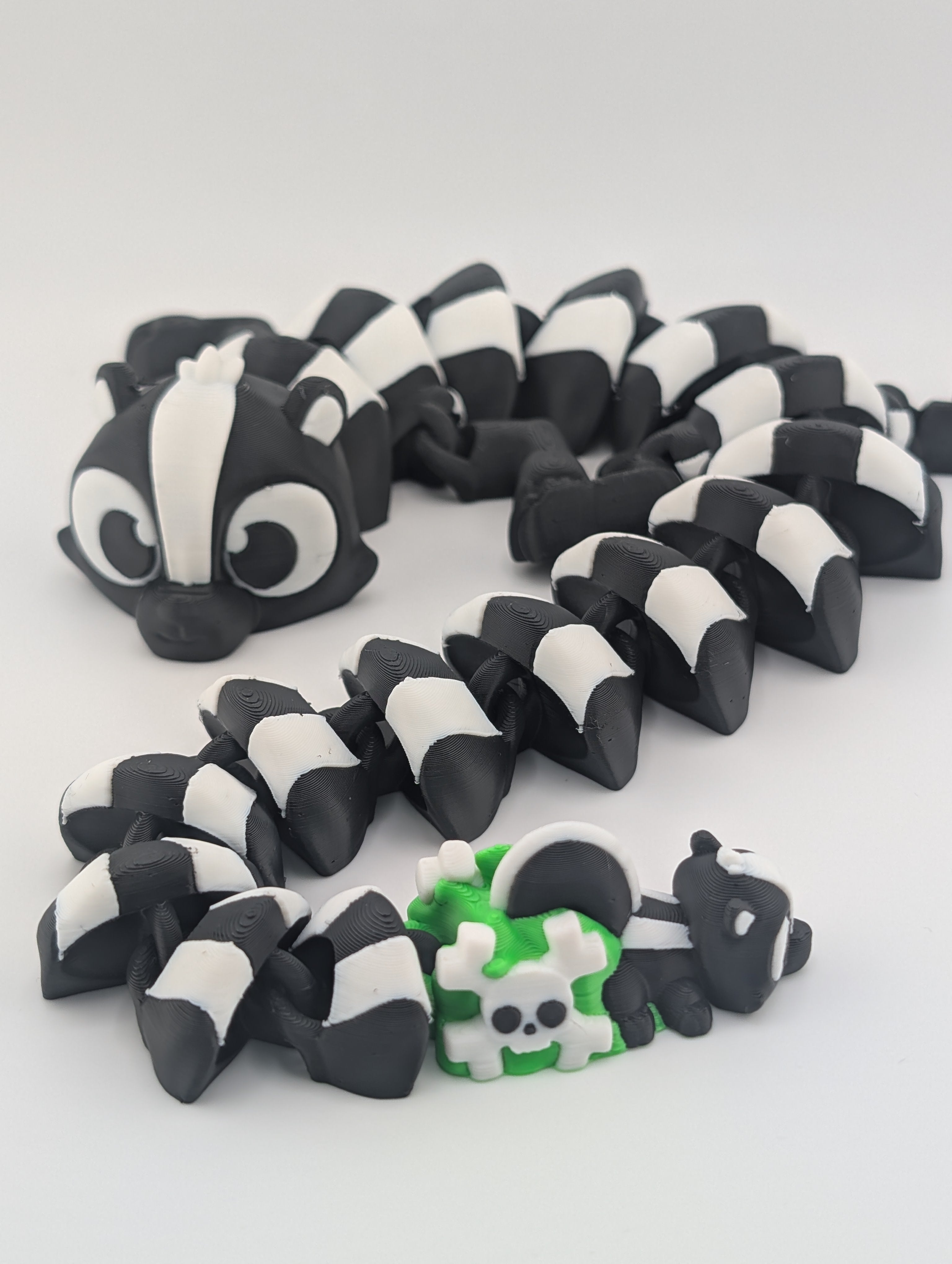Skunk Flexi Dragon – 17.5" Articulated Fidget Friend