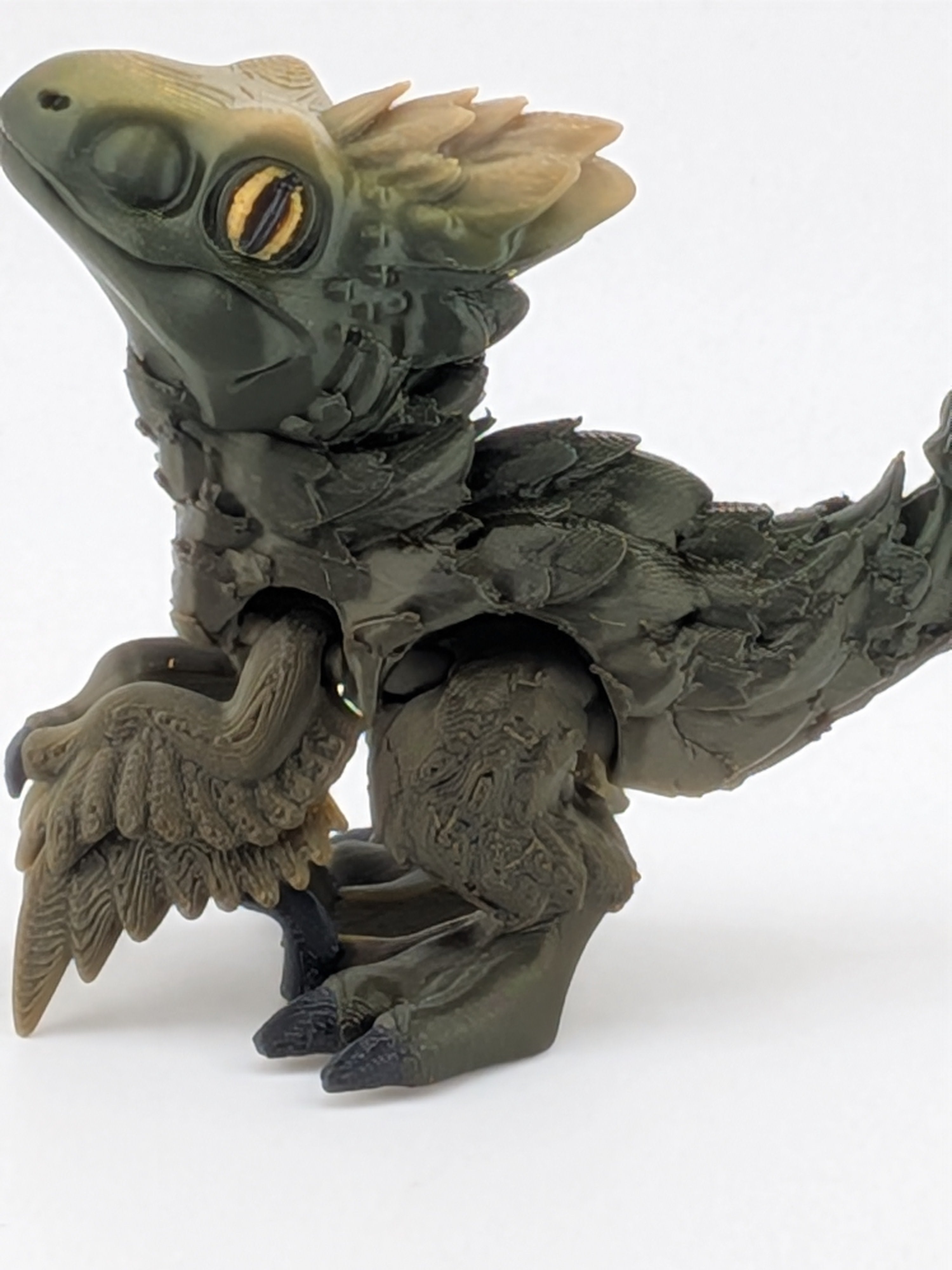 3.5 Inch Articulated Pyroraptor Dinosaur Camo and Pastel Rainbow Filament Toy