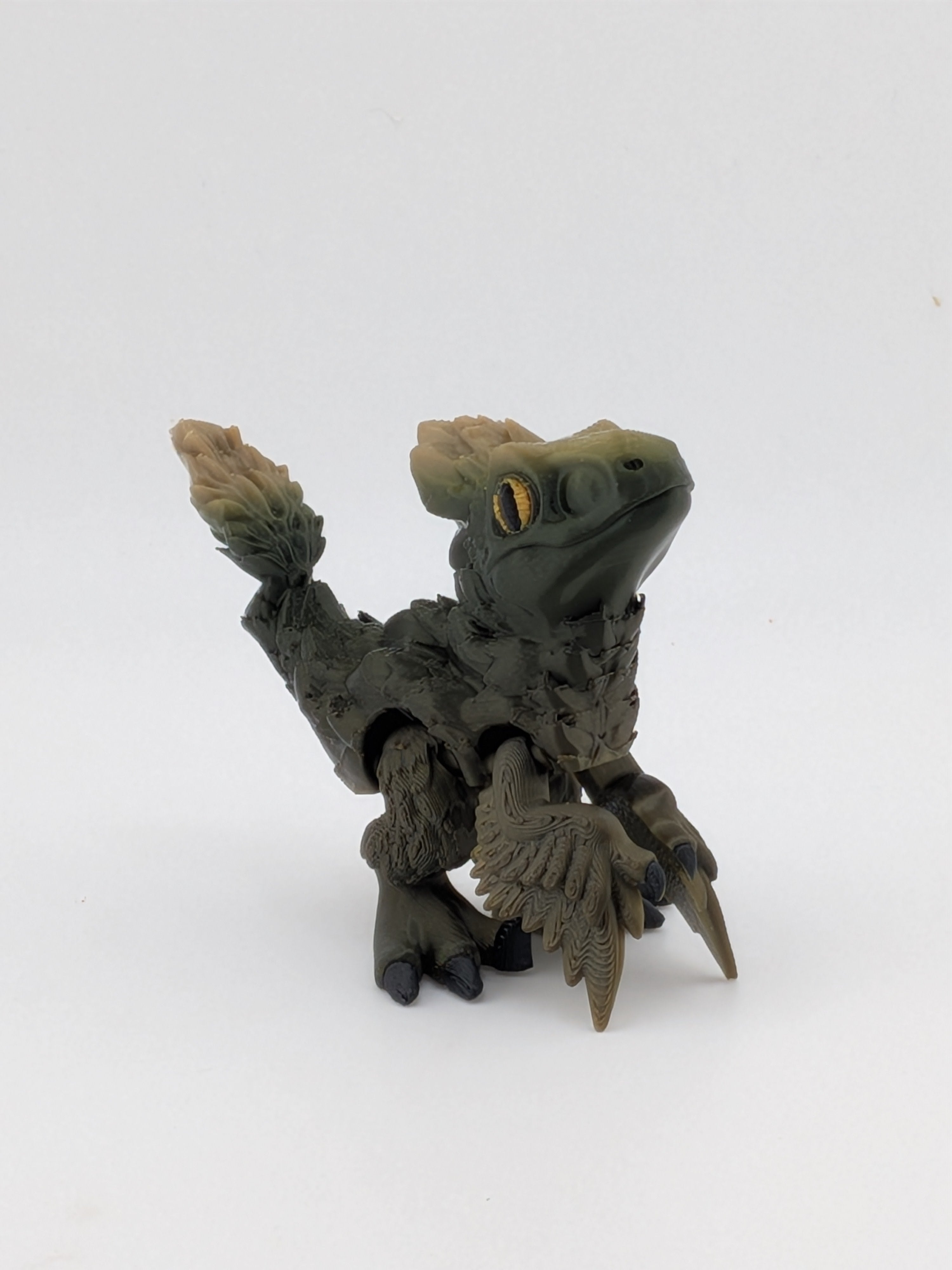 3.5 Inch Articulated Pyroraptor Dinosaur Camo and Pastel Rainbow Filament Toy