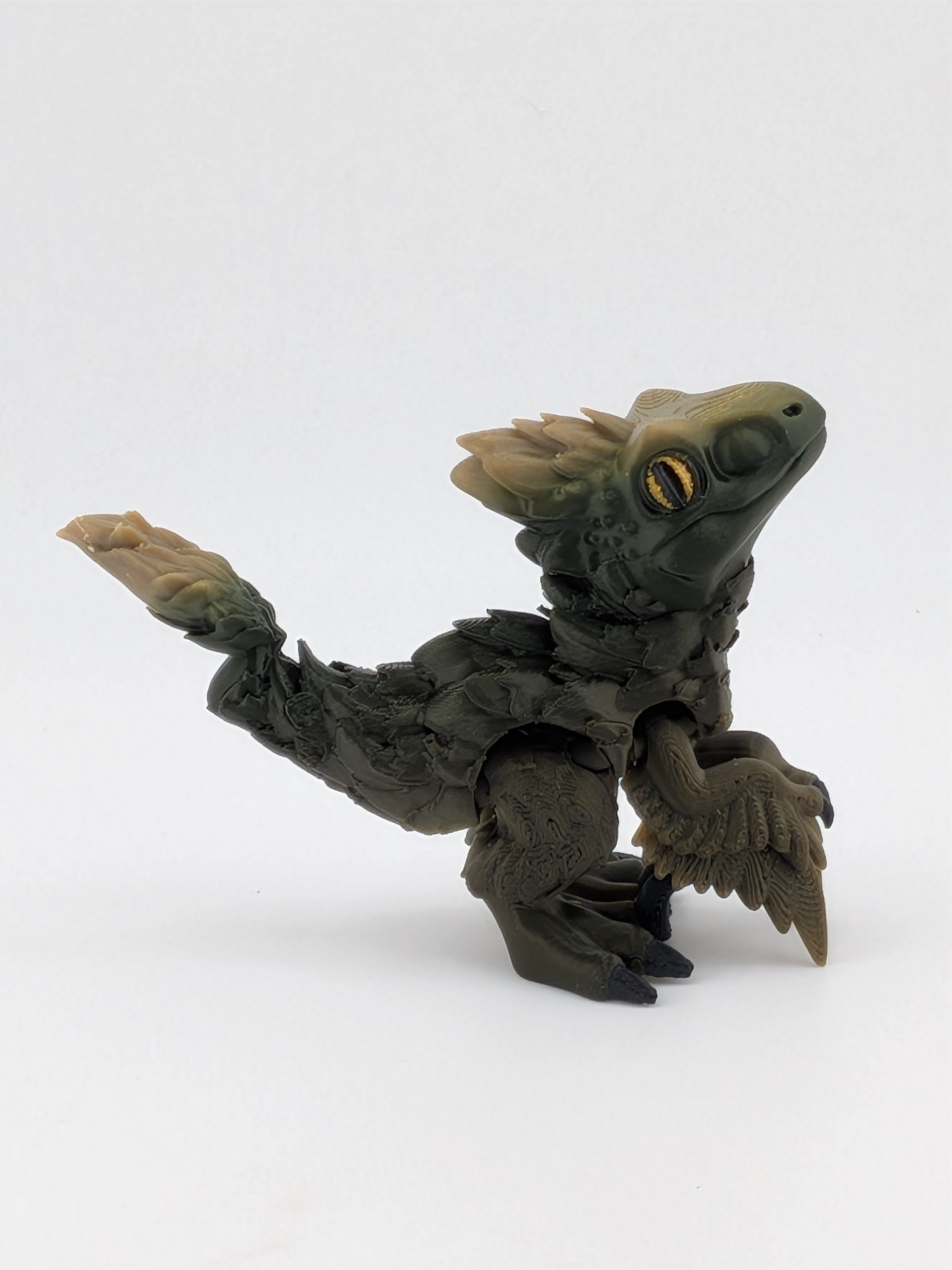 3.5 Inch Articulated Pyroraptor Dinosaur Camo and Pastel Rainbow Filament Toy