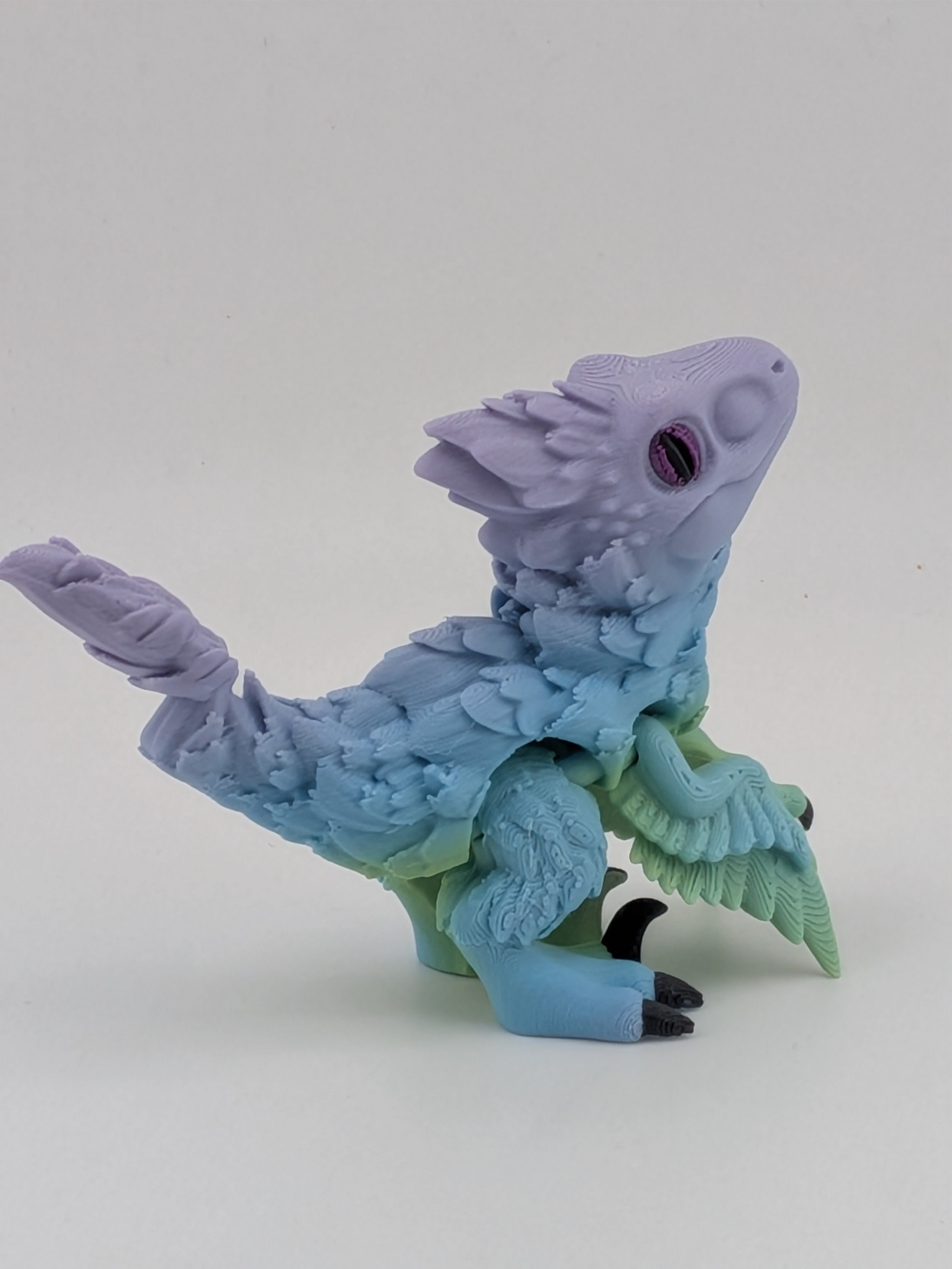 3.5 Inch Articulated Pyroraptor Dinosaur Camo and Pastel Rainbow Filament Toy