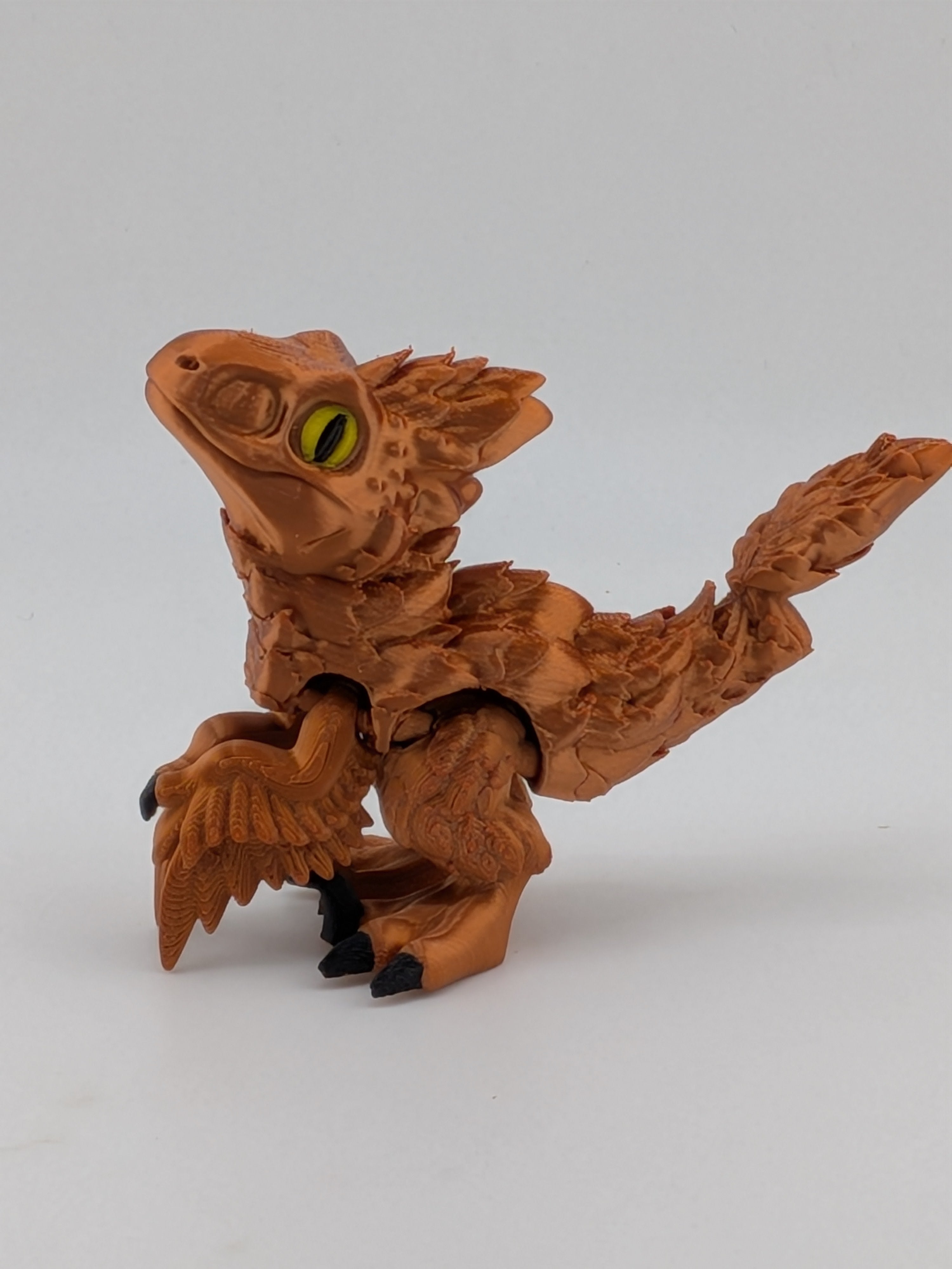 3.5 Inch Articulated Pyroraptor Dinosaur Camo and Pastel Rainbow Filament Toy
