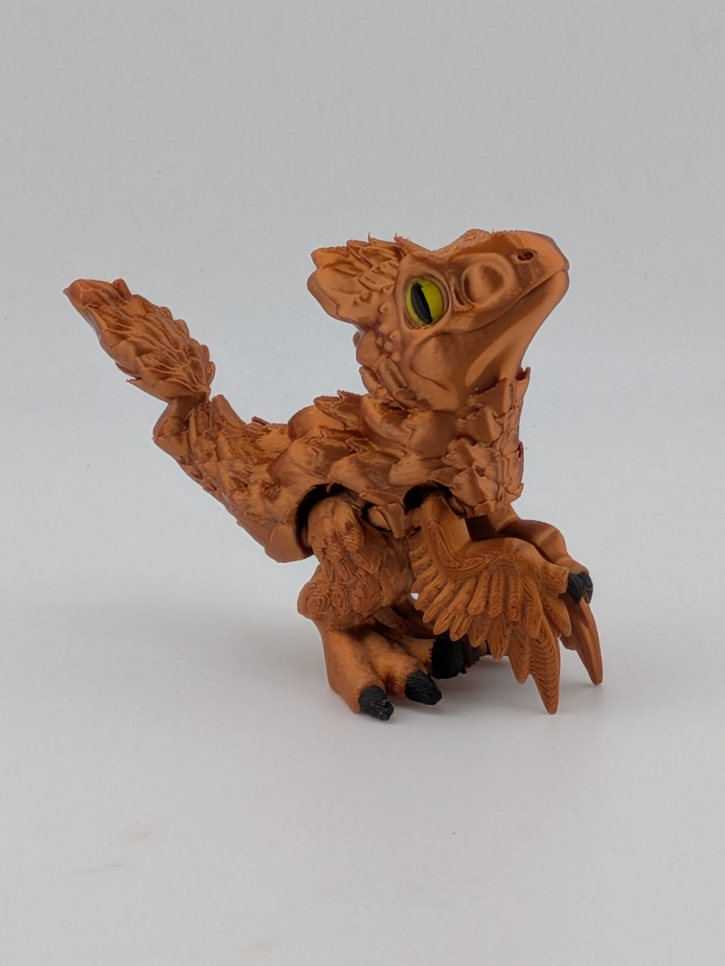 3.5 Inch Articulated Pyroraptor Dinosaur Camo and Pastel Rainbow Filament Toy