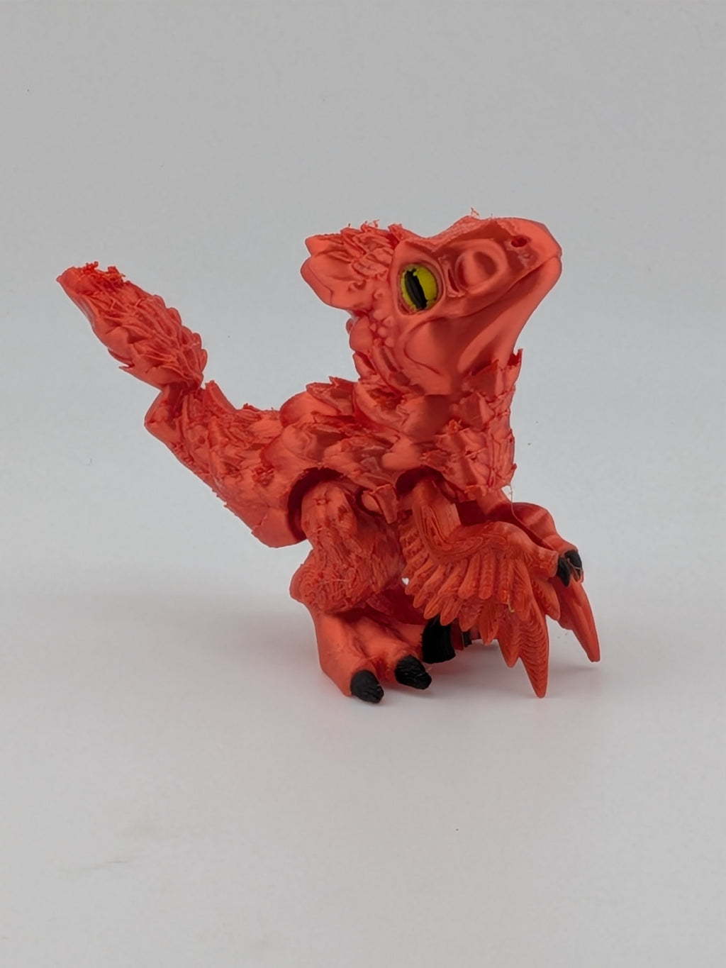 3.5 Inch Articulated Pyroraptor Dinosaur Camo and Pastel Rainbow Filament Toy