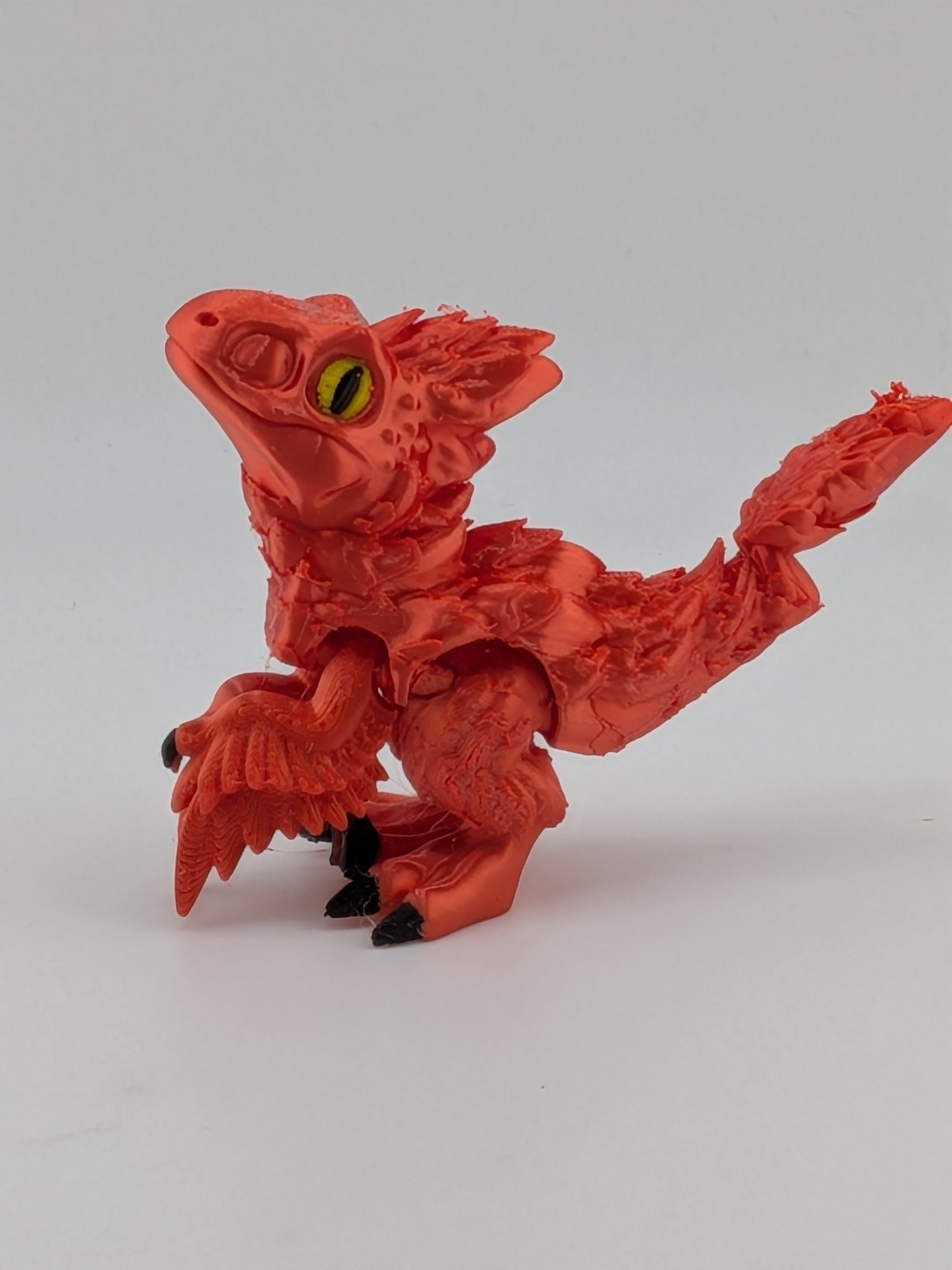 3.5 Inch Articulated Pyroraptor Dinosaur Camo and Pastel Rainbow Filament Toy
