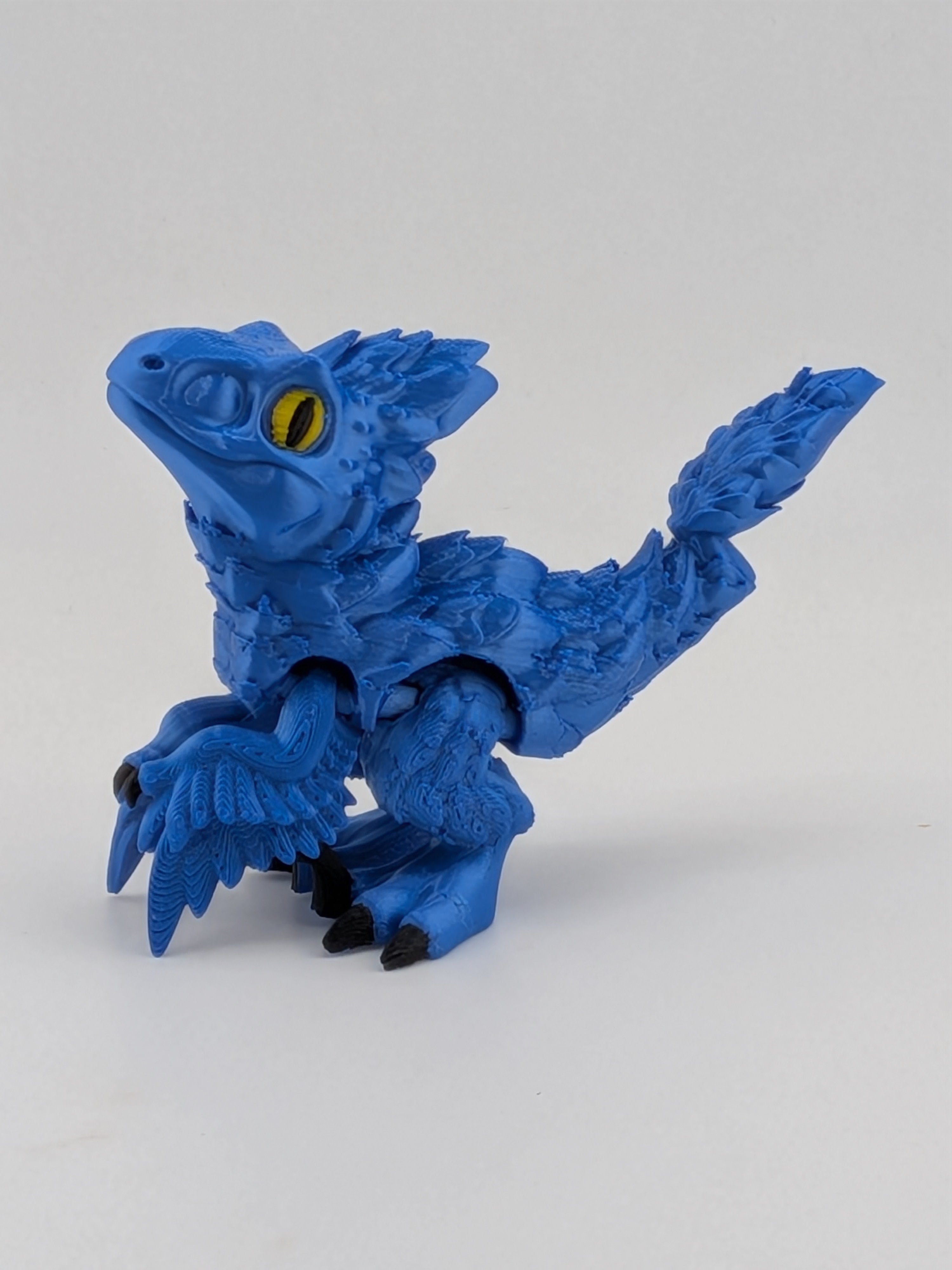 3.5 Inch Articulated Pyroraptor Dinosaur Camo and Pastel Rainbow Filament Toy