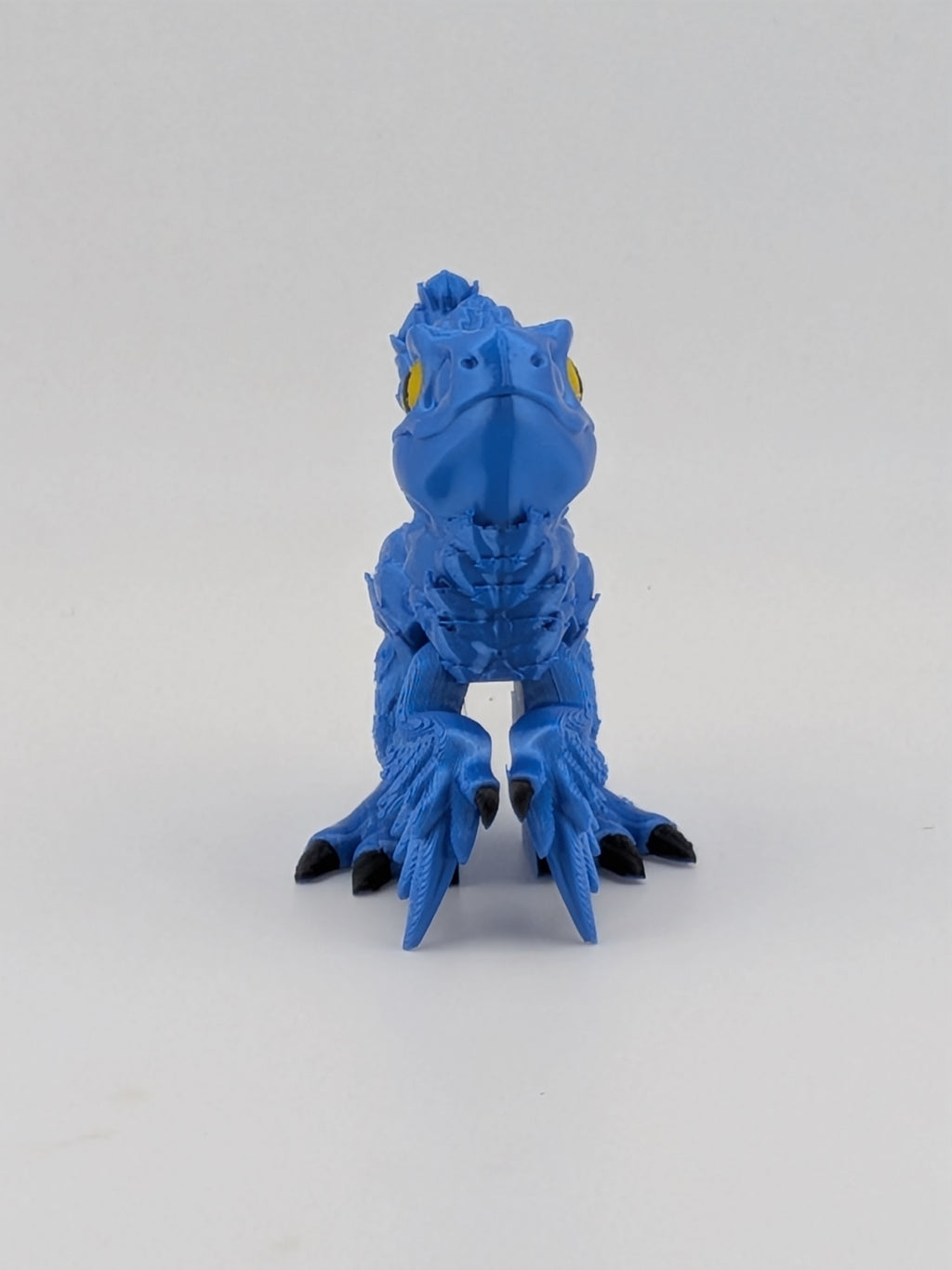 3.5 Inch Articulated Pyroraptor Dinosaur Camo and Pastel Rainbow Filament Toy