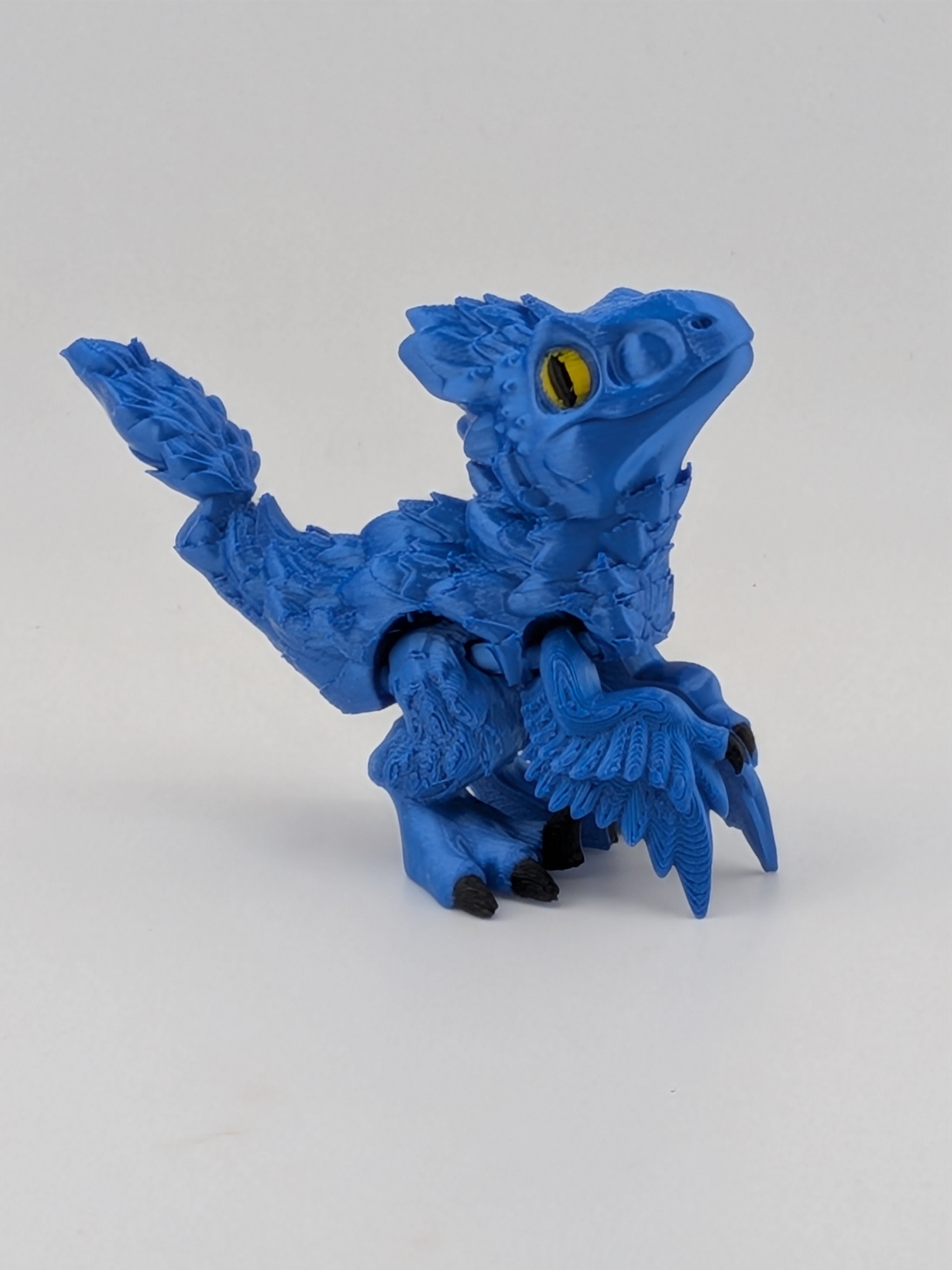 3.5 Inch Articulated Pyroraptor Dinosaur Camo and Pastel Rainbow Filament Toy