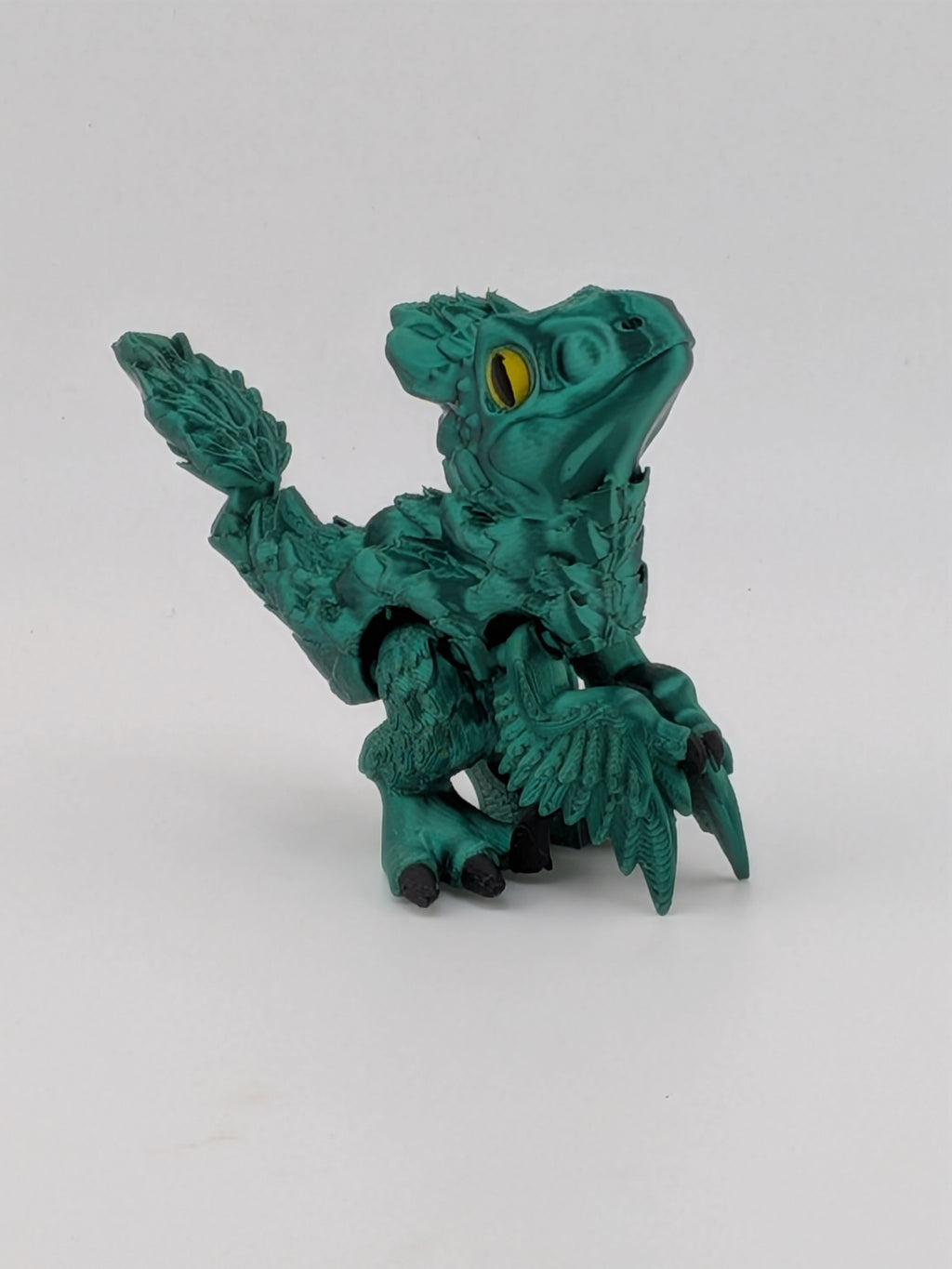 3.5 Inch Articulated Pyroraptor Dinosaur Camo and Pastel Rainbow Filament Toy