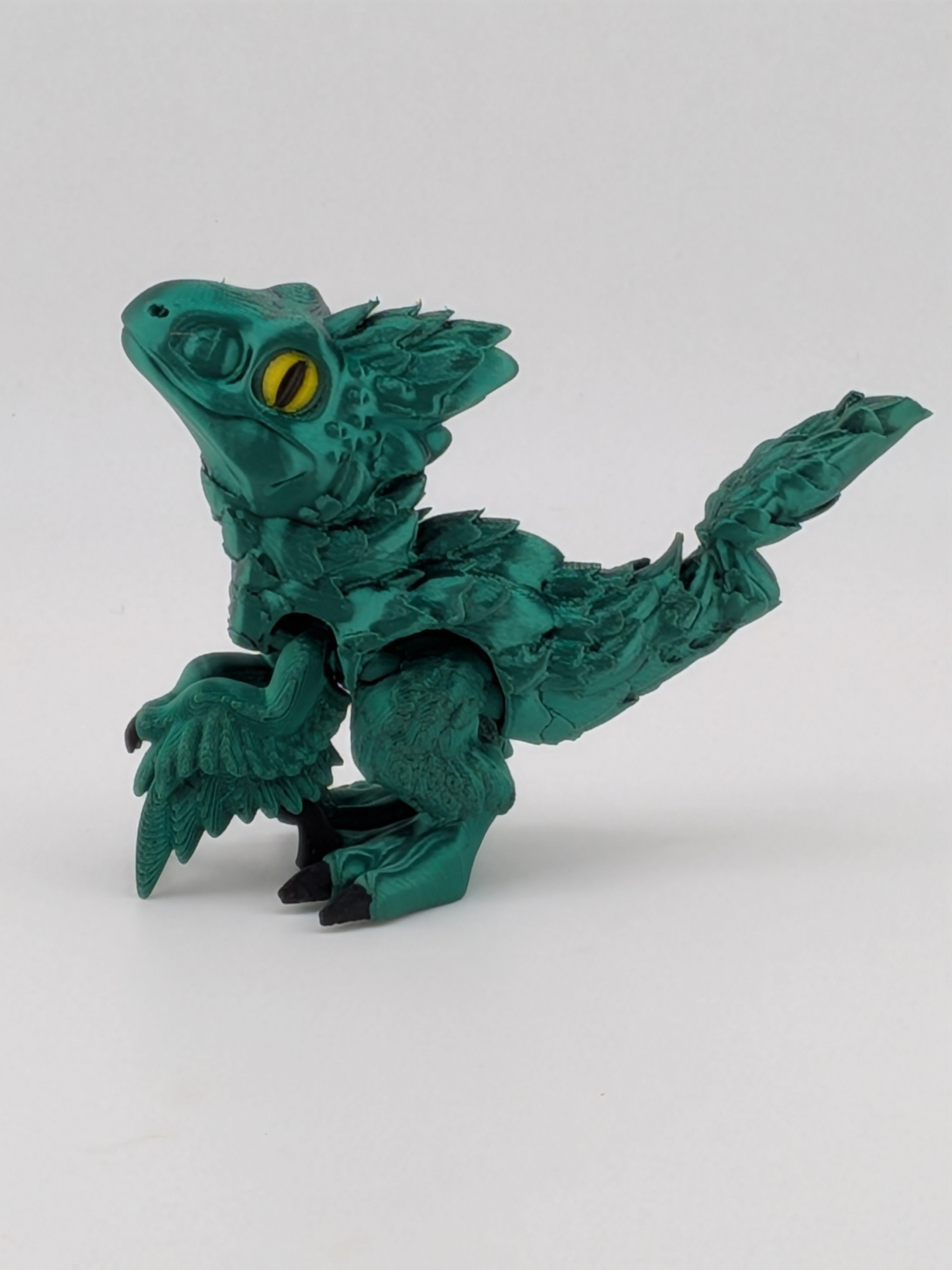 3.5 Inch Articulated Pyroraptor Dinosaur Camo and Pastel Rainbow Filament Toy